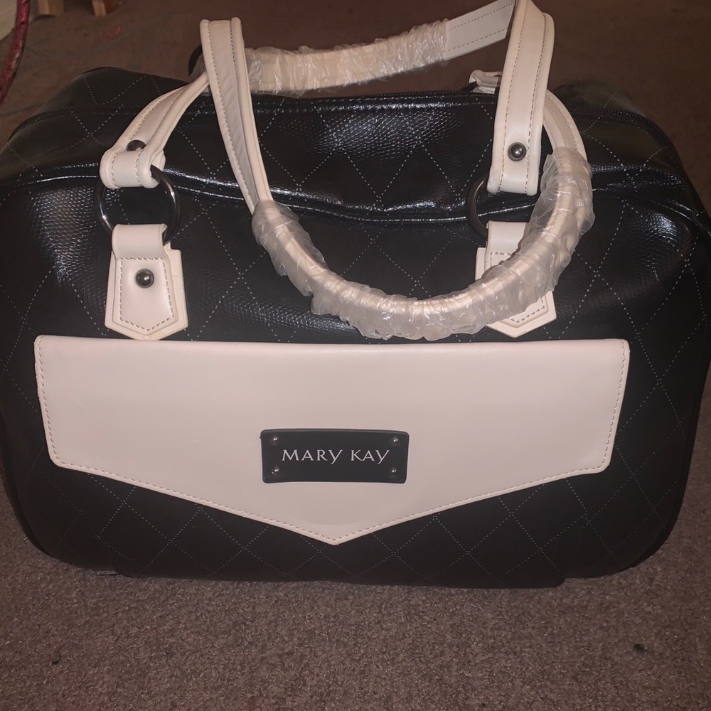 A Black and White Faux Leather Mary Kay Bag
